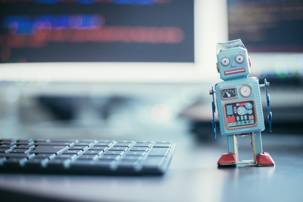Symbol for a chatbot or social bot and algorithms program code in the background