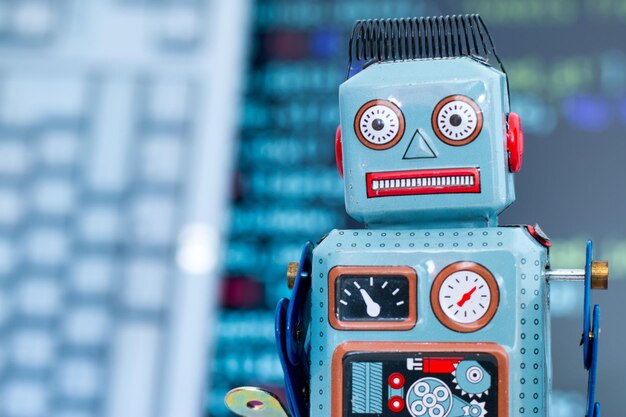 Symbol for a chatbot or social bot and algorithms program code in the background