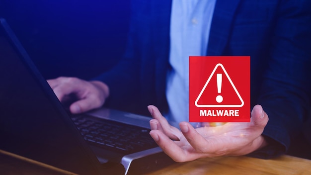 system hacked warning alert on laptop cyber attack on computer network virus spyware malware or malicious software cyber security and cybercrime compromised information internet