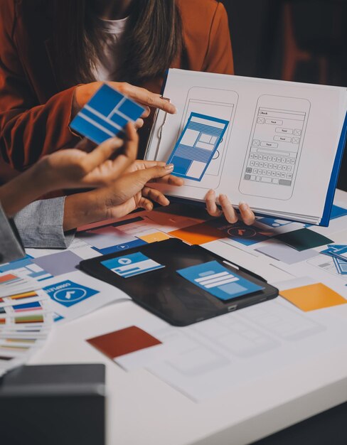 team of UI UX web designer are working together to develop mobile responsive websites Mobile Mockup