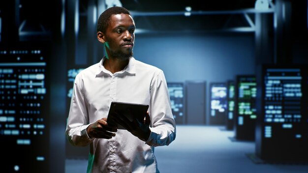 Technician doing checkup in server room