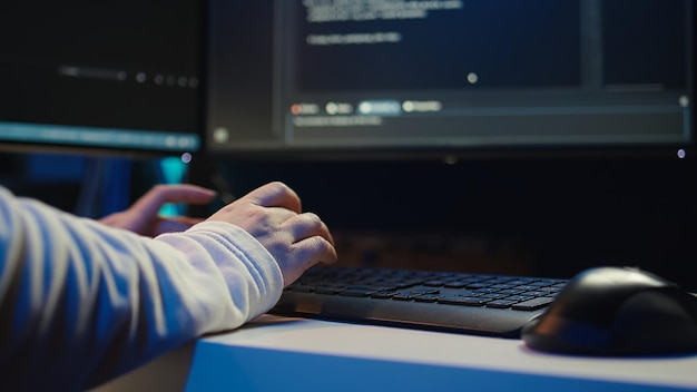 technician doing software quality assurance reading source code on pc