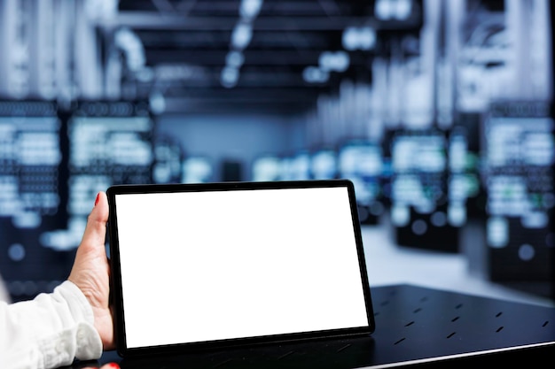 Technician using tablet in data center