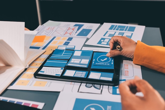 The designer team is designing the uxui system to make the uxui system work well on new phones and support system updates Website development concept UI UX front end designer