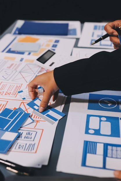 The designer team is designing the uxui system to make the uxui system work well on new phones and support system updates Website development concept UI UX front end designer