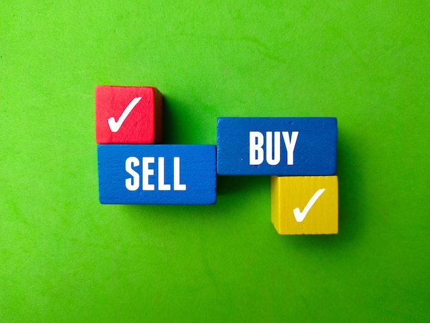 top view colord cube with text sell buy on green background