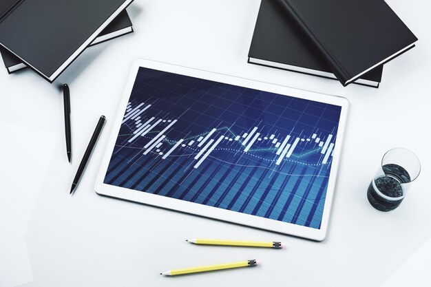 Top view of abstract creative financial graph on modern digital tablet screen forex concept