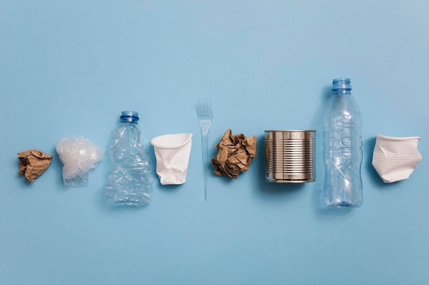Top view of rubbish for recycling on a blue background