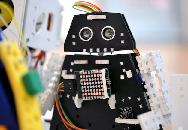 Toy robots prototypes close-up concept automation background