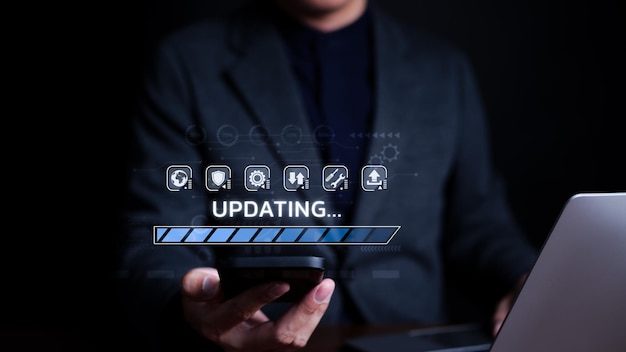 Update software application upgrade technology concept Man using smart phone Software update or Operating system updating progress bar Install app patch new version Improved security