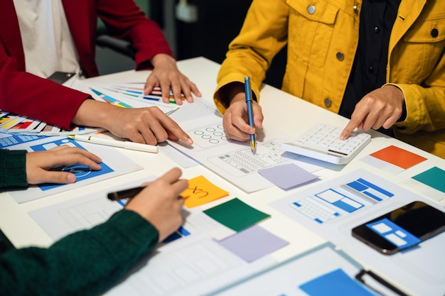 UX developer and ui designer brainstorming about mobile app interface wireframe design with customer breif and color code User experience concept