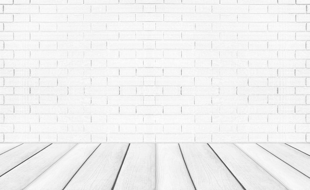 White empty wooden floors with brick wall background Studio or office blank space