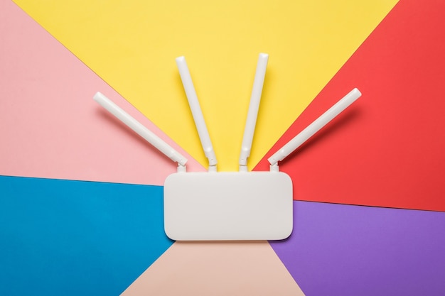 Wi-Fi router with external antennas on a multi-colored surface