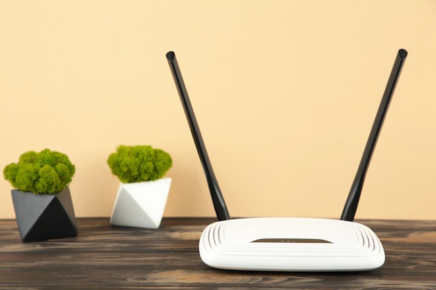 wireless wi-fi router on brown surface with copy space