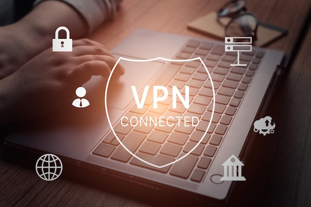 Woman hand using laptop with vpn icon on VR screen VPN Virtual Private network protocol concept
