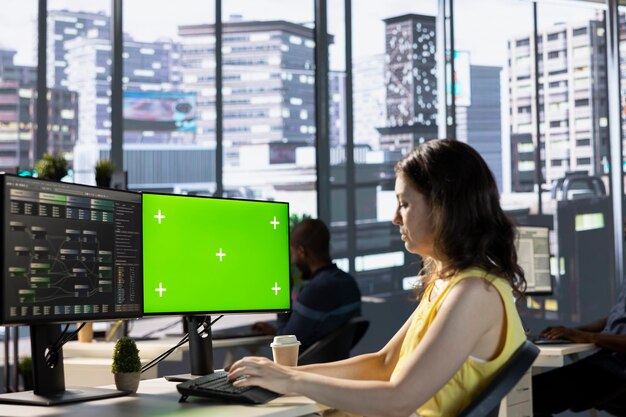 woman monitoring and maintaining company systems using mockup pc