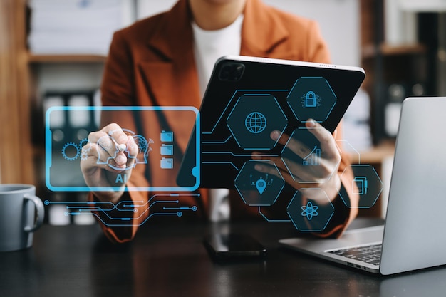 Woman using chatbot in computer and tablet smart intelligence AiChat with AI Artificial Intelligence developed by OpenAI generate Futuristic technology robot in online systemxA
