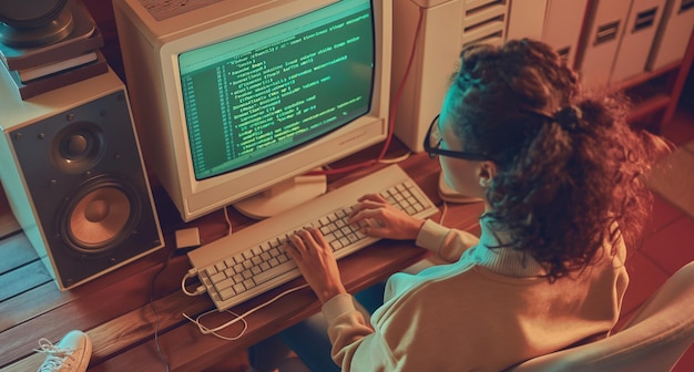 Woman using computer with green screen