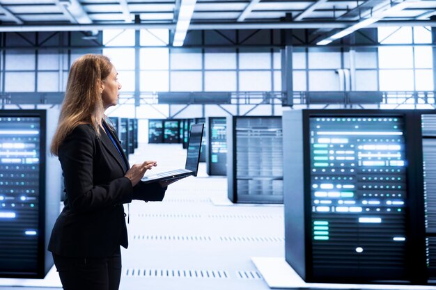 Woman walking in high tech facility doing upgrades