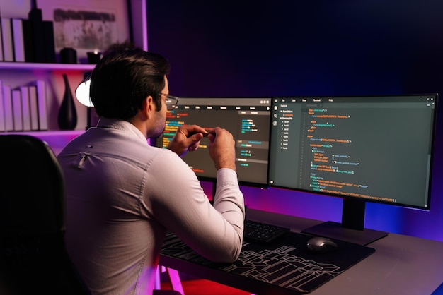 Working smart it developer analyzing data software development on pc surmise