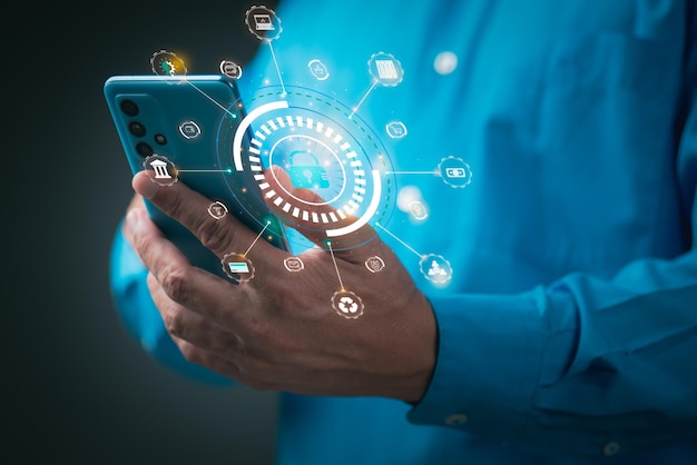 Young businessman is using a mobile phone to access security system