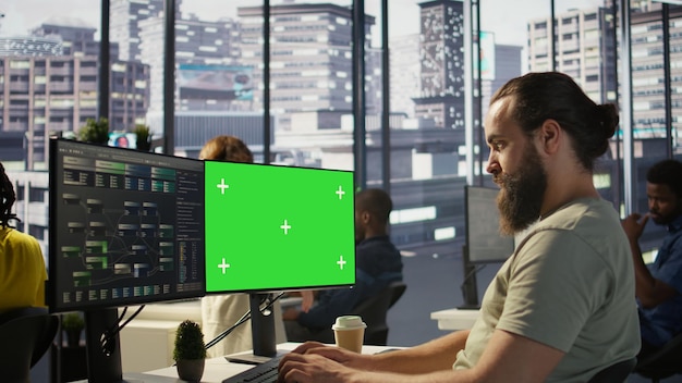 Zoom in on mockup PC monitor used by IT expert in office