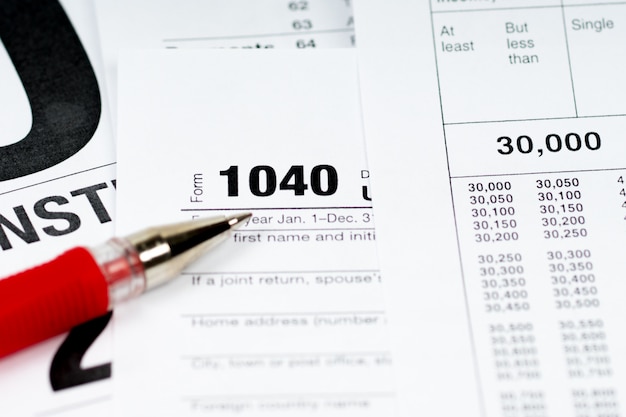 00 tax form with tax tables and red pen