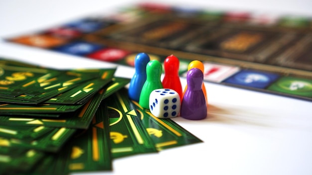 01-09-2020 Minsk,Belarus Board game Monopoly with money and plastic chips. No logos or visible brands - pink background