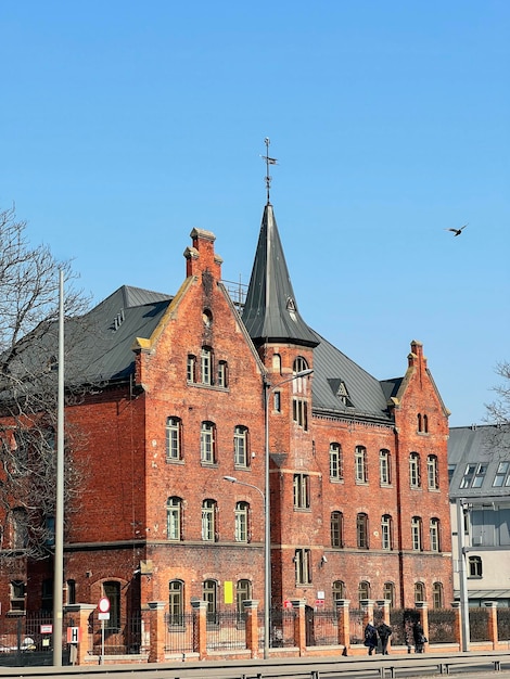 03282022 Gdansk Poland Old European building made of red brick from 19th or 20th century at Juliusza Slowackiego 15 Danzig free city heritage