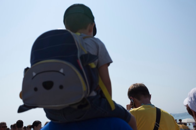 08.24.2021, Ukraine, Odessa. People watch the parade of the Ukrainian naval forces during the celebration of the 30th anniversary of Ukraine's independence on the seashore.