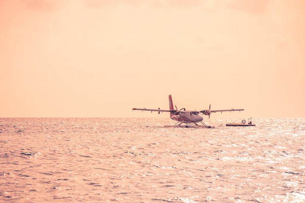 08092019 Ari Atoll Maldives Exotic scene with seaplane on Maldives sea landing Seaplane taxi