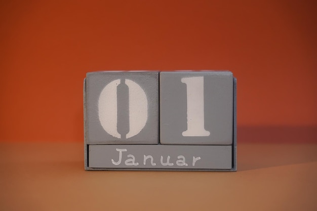 1 Januar on wooden grey cubes Calendar cube date 01 January Concept of date Copy space for text or event Educational cubes Cube shape calendar for January 1 with empty space Selective focus