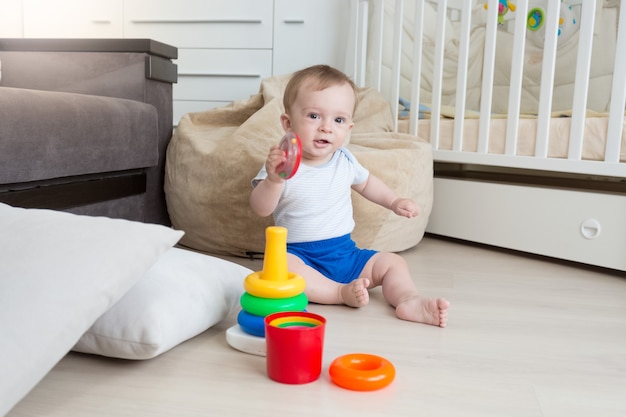 1 year old baby boy crawling on bed