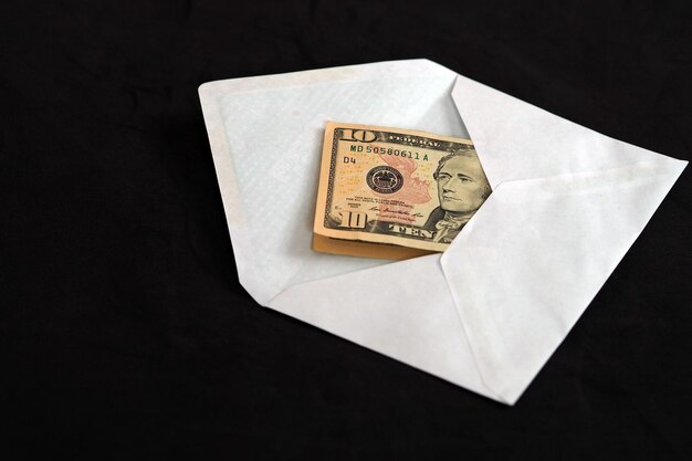 10 dollars in a white envelope 10 in white envelope