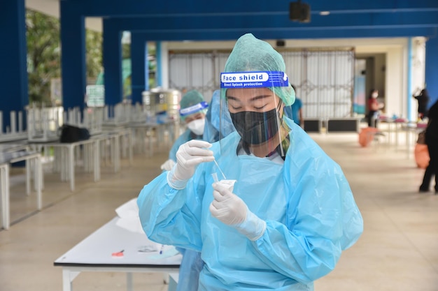 Photo 10 nov 2021; chiang rai, thailand:teachers use rapid self-testing antigen kits. (atk)covid-19 test for students