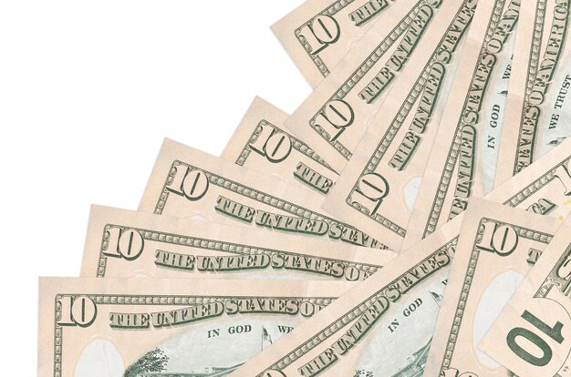 Photo 10 us dollars bills lies in different order isolated on white. local banking or money making concept.