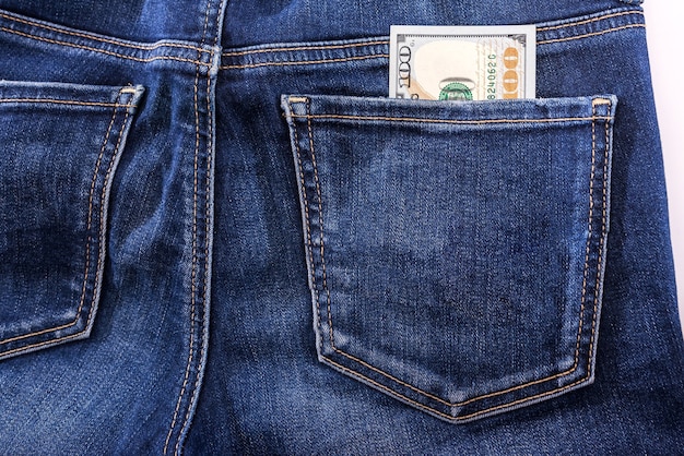 100 dollars in jeans pocket. Close-up.