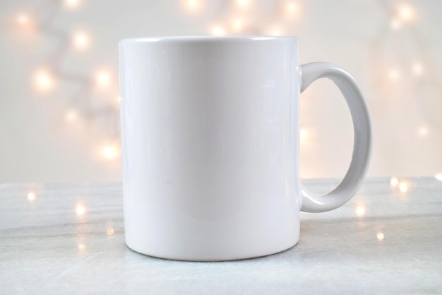 Photo 11 oz white coffee mug chilling amongst elegant white lights