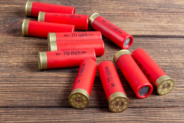 12 gauge caliber color cartridges, hunting shells on a brown wooden