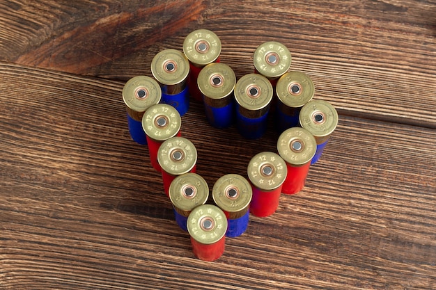 12 gauge caliber color cartridges hunting shells in a heart shape