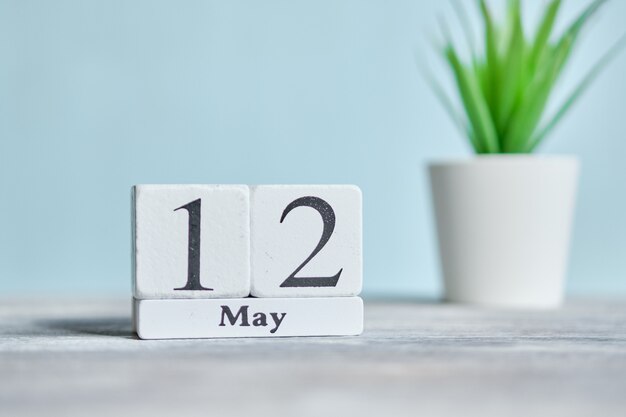 12 twelfth day May Month Calendar Concept on Wooden Blocks.