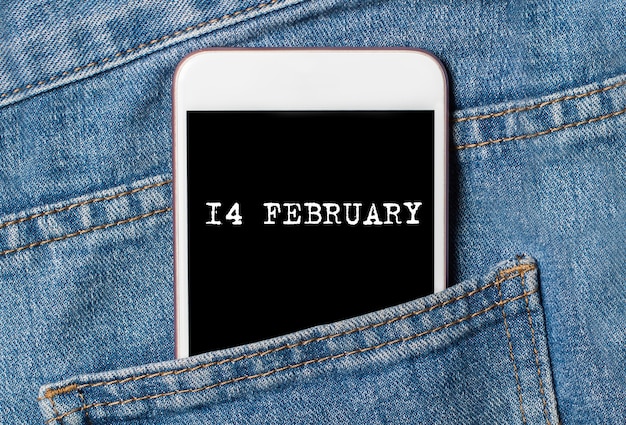 14 february on background phone on jeans love and valentine concept