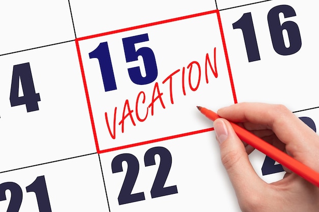 15th day of the month hand writing text vacation on calendar date