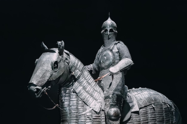 17 january 2025 louvre museum abu dhabi uae knight in shining armor riding his armored horse against a dark background