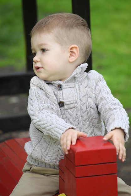 Photo 2 years old baby boy on playground