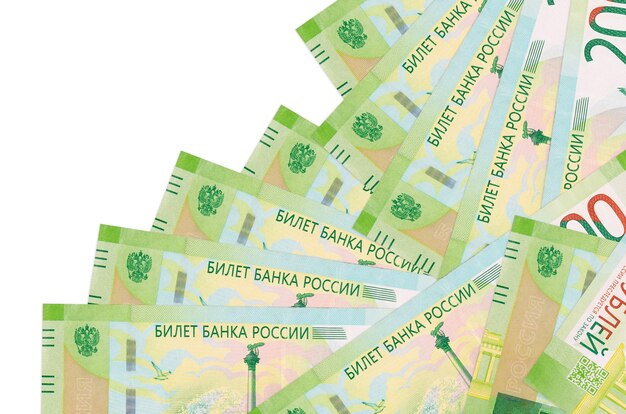 Photo 200 russian rubles bills lies in different order isolated on white. local banking or money making concept. 