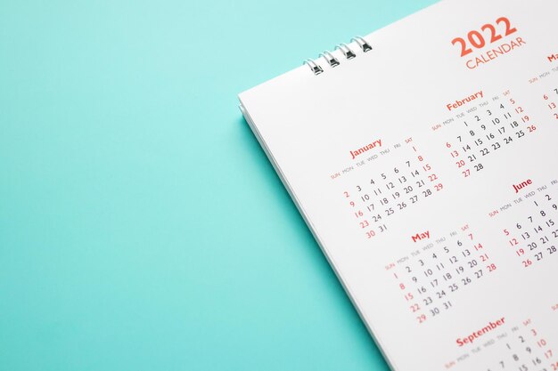 2022 calendar page on blue background business planning appointment meeting concept