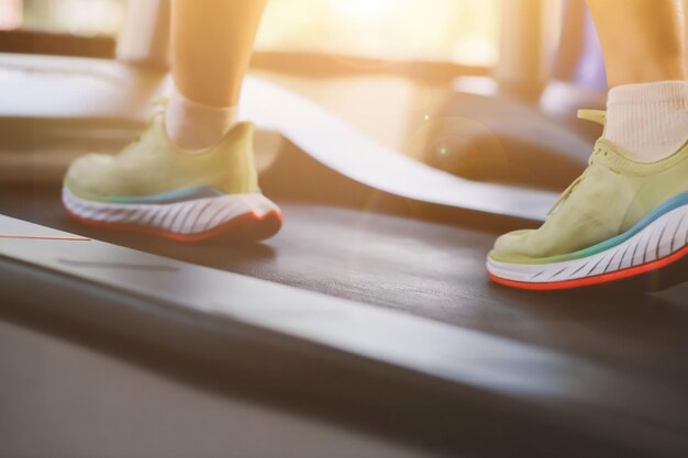 2022 concept closeup photo of female jogging shoes in the\
morning health care