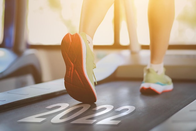 2022 concept closeup photo of female jogging shoes in the\
morning health care