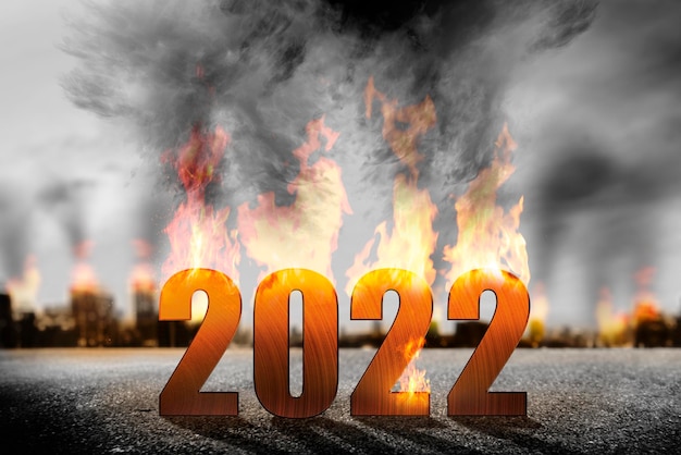 2022 on fires with dramatic background. Happy New Year 2022